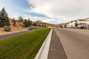 View of street with curbs and a residential view