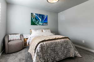 Carpeted bedroom with baseboards