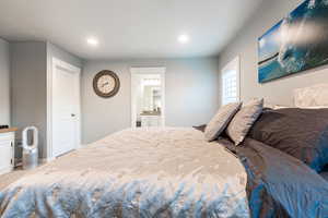 Bedroom with recessed lighting and ensuite bath