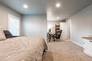 Bedroom featuring recessed lighting, baseboards, and light colored carpet