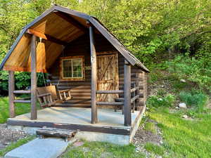 View of outbuilding with an outdoor structure