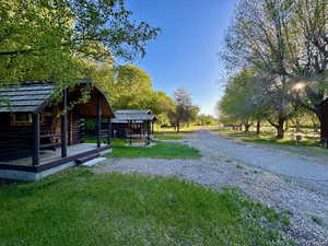 Exterior space with an outbuilding and a yard