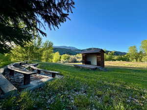 View of yard featuring an outbuilding and a mountain view