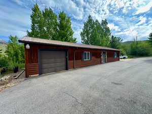 View of horse barn featuring a mountain view