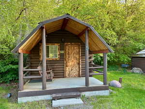 View of outdoor structure featuring an outbuilding