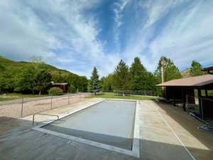View of swimming pool featuring fence