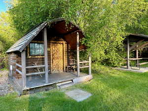 View of outbuilding with an outdoor structure