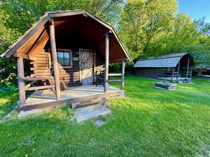 View of outdoor structure with an outbuilding