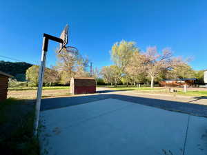 View of basketball court with a shed