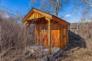 Small shed that was previously used as an art studio, near the back of the property