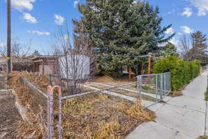 Fully fenced yard, with carport and oversized, one car garage