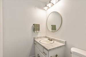 Bathroom with vanity and toilet