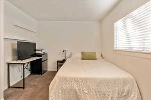 Carpeted bedroom with baseboards