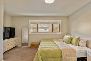 Bedroom with carpet and baseboards