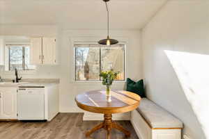 Dining area featuring breakfast area, baseboards, and wood finished floors