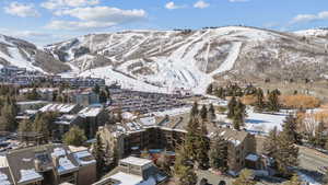 Snowy aerial view featuring a mountain view