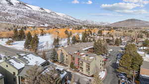 Snowy aerial view with a residential view and a mountain view