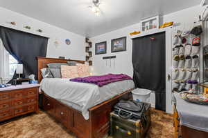 Bedroom featuring light colored carpet