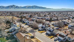 Drone / aerial view with a residential view and a mountain view