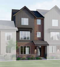 View of front of home with board and batten siding and brick siding