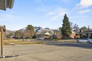 View of road with a residential view and a mountain view