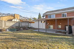 View of yard featuring a patio and fence