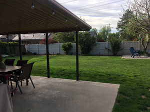 View of yard featuring fence private yard, a patio area, and outdoor dining space