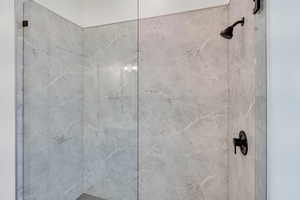 Full bath with a tile shower