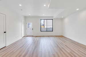 Entrance foyer featuring recessed lighting, baseboards, and light wood finished floors