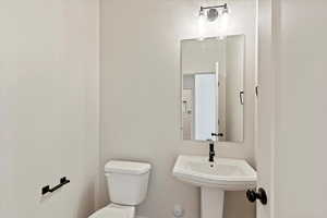 Bathroom featuring toilet and a sink