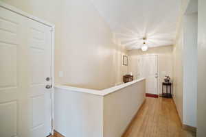 Corridor featuring light wood-type flooring