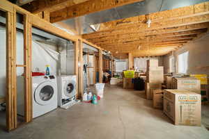 Below grade area featuring washing machine and dryer