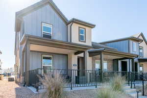 View of front of home featuring board and batten siding and a porch