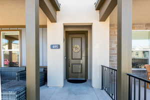 Entrance to property featuring stucco siding