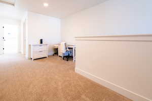 Interior space featuring light carpet and baseboards