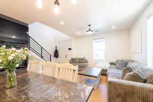 Living area featuring stairway, hardwood / wood-style floors, and recessed lighting