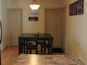 Dining area with light wood-type flooring (older picture)