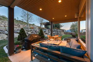 View of patio / terrace featuring an outdoor hangout area, fence, outdoor dining space, and grilling area