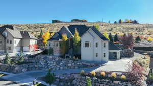 View of front of home featuring driveway and a garage