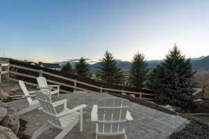 View of patio / terrace with a mountain view and a fenced backyard