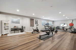 Exercise room featuring hardwood / wood-style floors