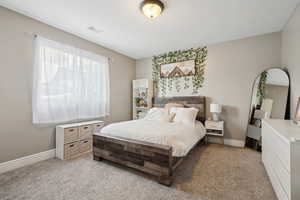 View of carpeted bedroom