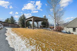 View of yard featuring a pergola