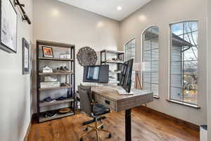 Home office featuring hardwood / wood-style floors