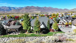 Property view of mountains with a residential view