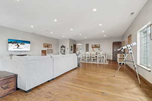 Living room with light hardwood / wood-style floors