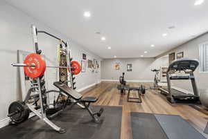 Workout area featuring hardwood / wood-style flooring