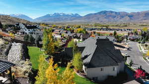 Drone / aerial view with a residential view and a mountain view