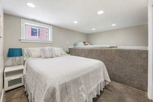 Bedroom with visible vents, dark carpet, baseboards, and recessed lighting