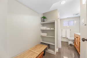 Full bath with toilet, tile patterned flooring, and visible vents